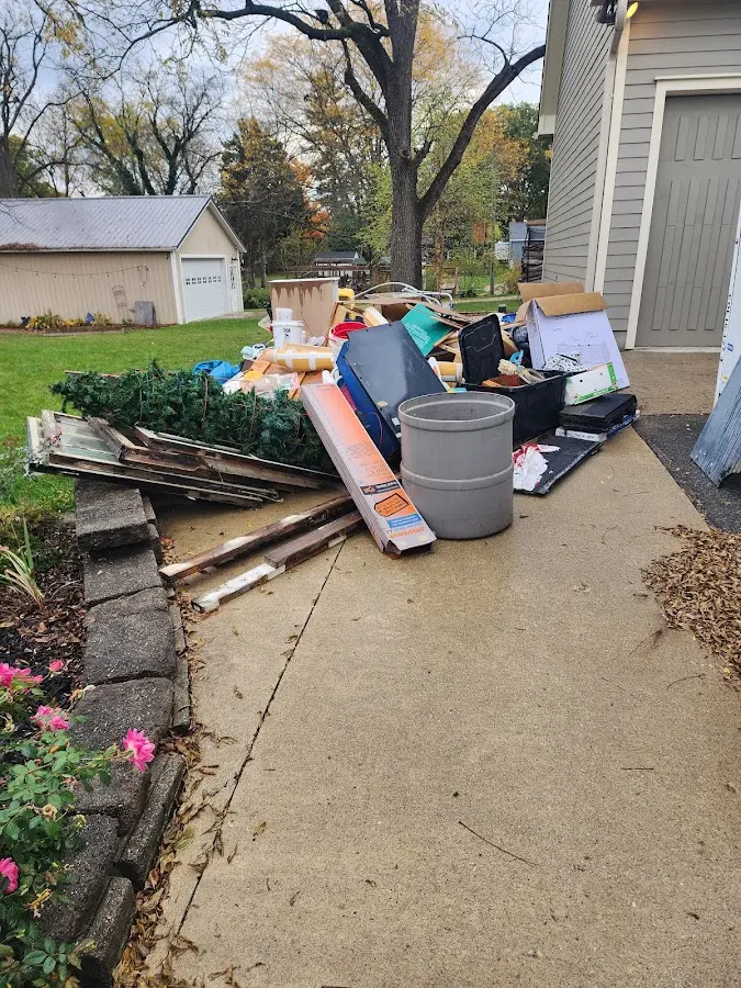 Dumpster being loaded with debris for Commercial Dumpster Rental in York